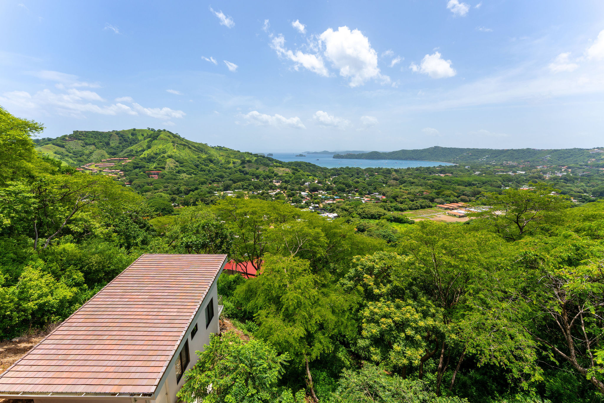 Panoramic view of the Pacific bay and green hills