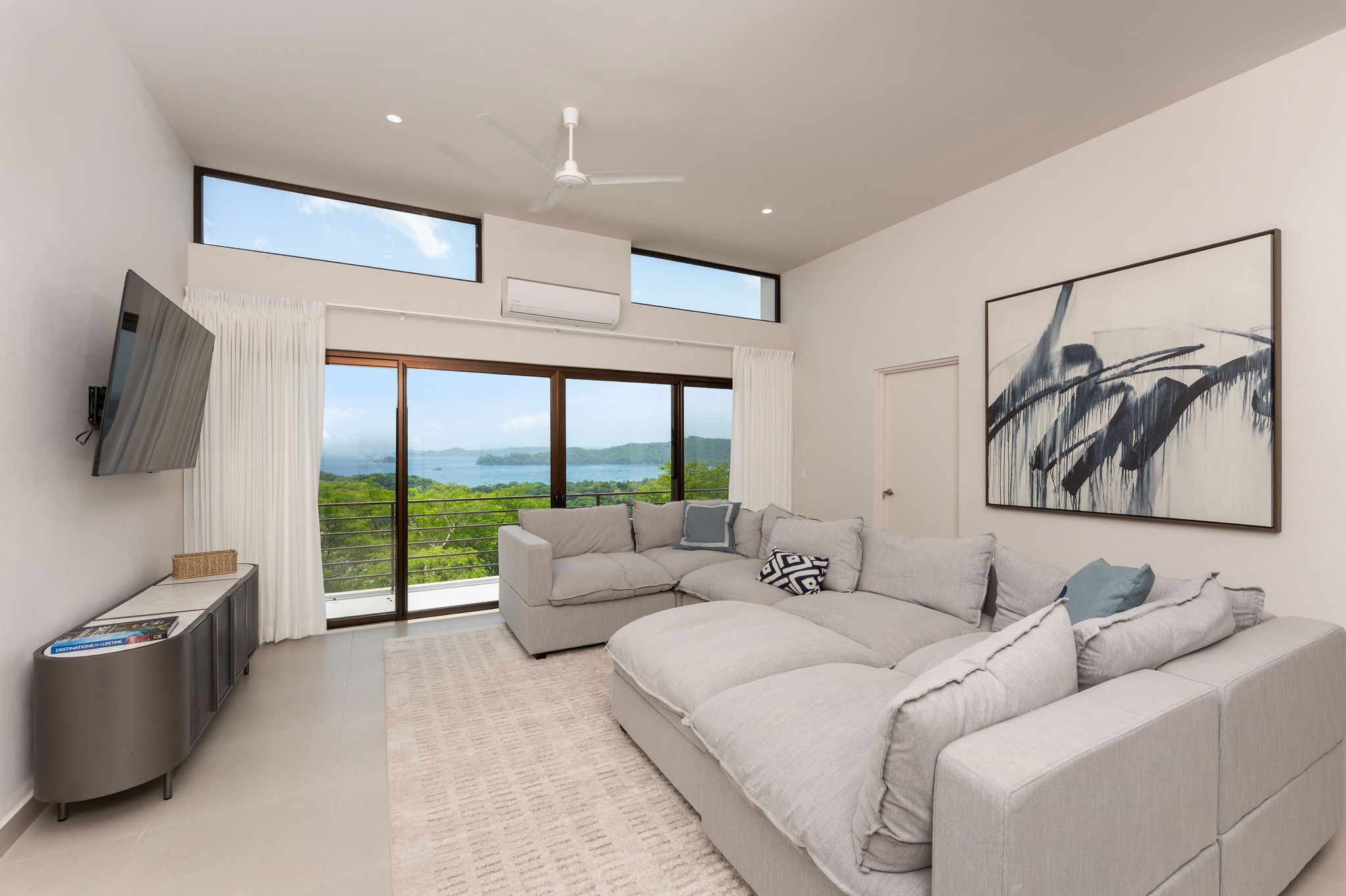 Family lounge with a large sectional and ocean views