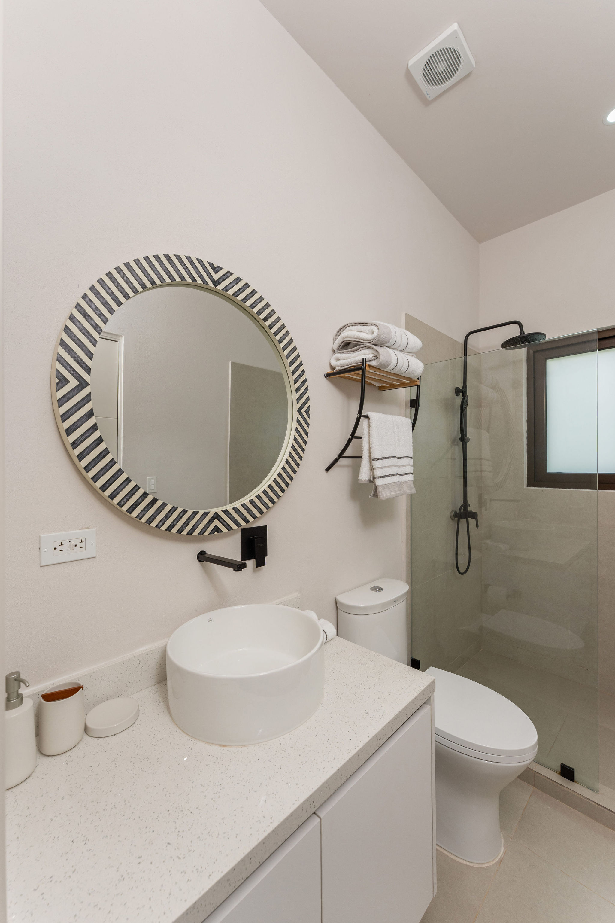 Bathroom with a walk-in shower and vessel sink