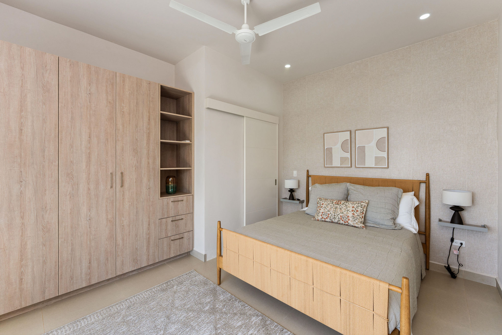 Bedroom with a king bed and generous wardrobe storage