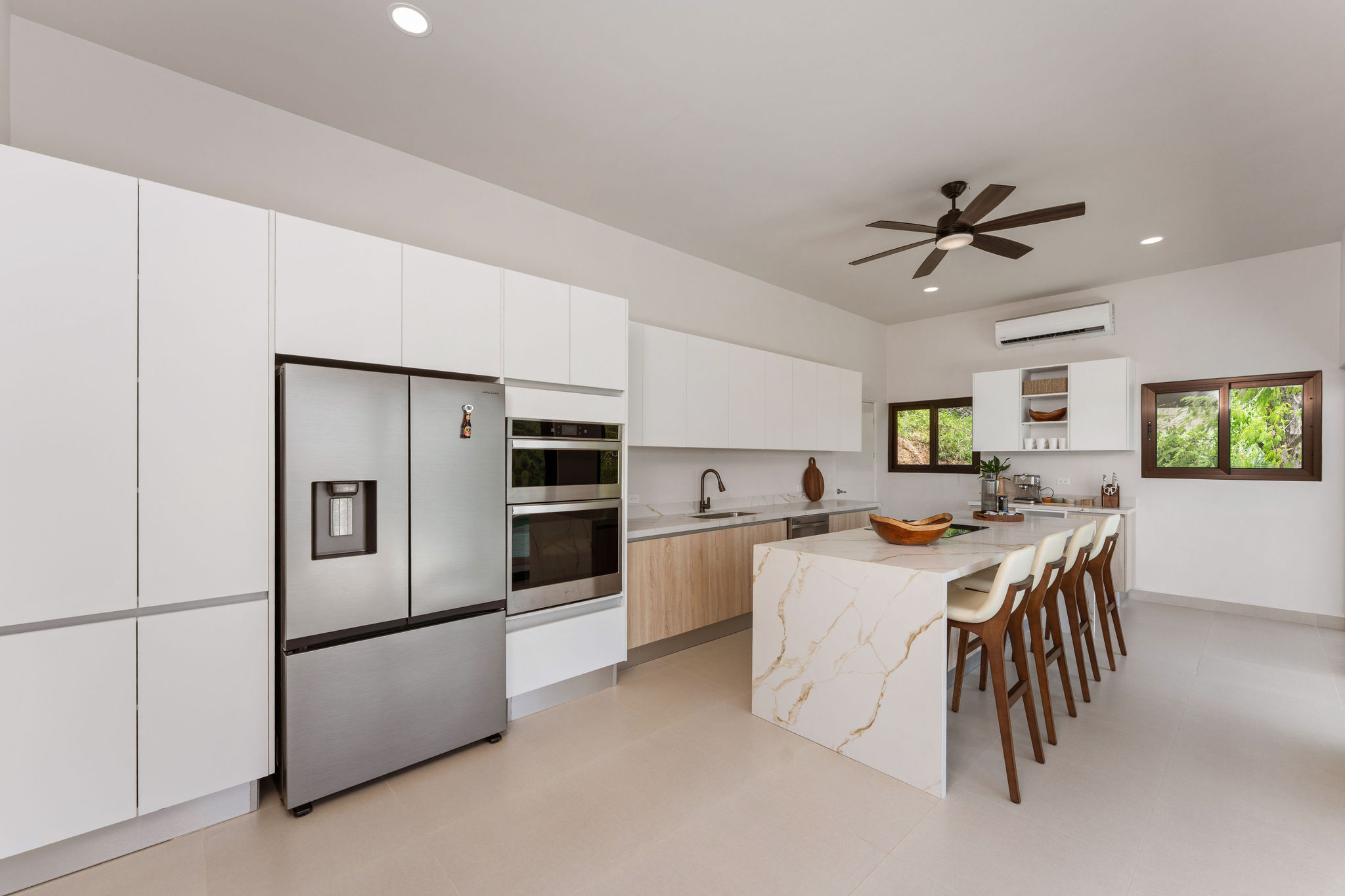 Modern kitchen with stainless steel appliances and island seating